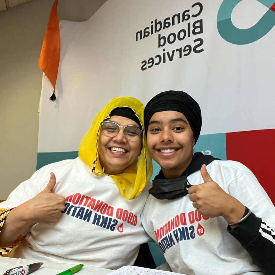 pic 3 Aneil and aunt volunteering at the Blood Donation drive run by the Sikh Community